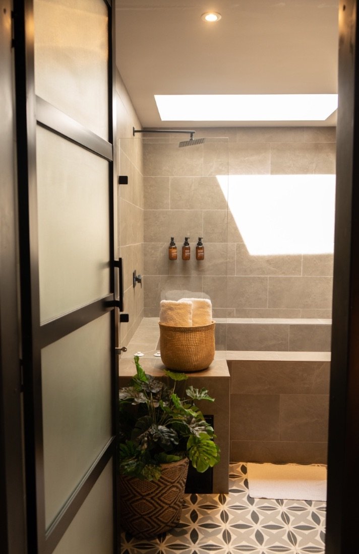 Spa-style walk-in shower in the Hot Tub Room
