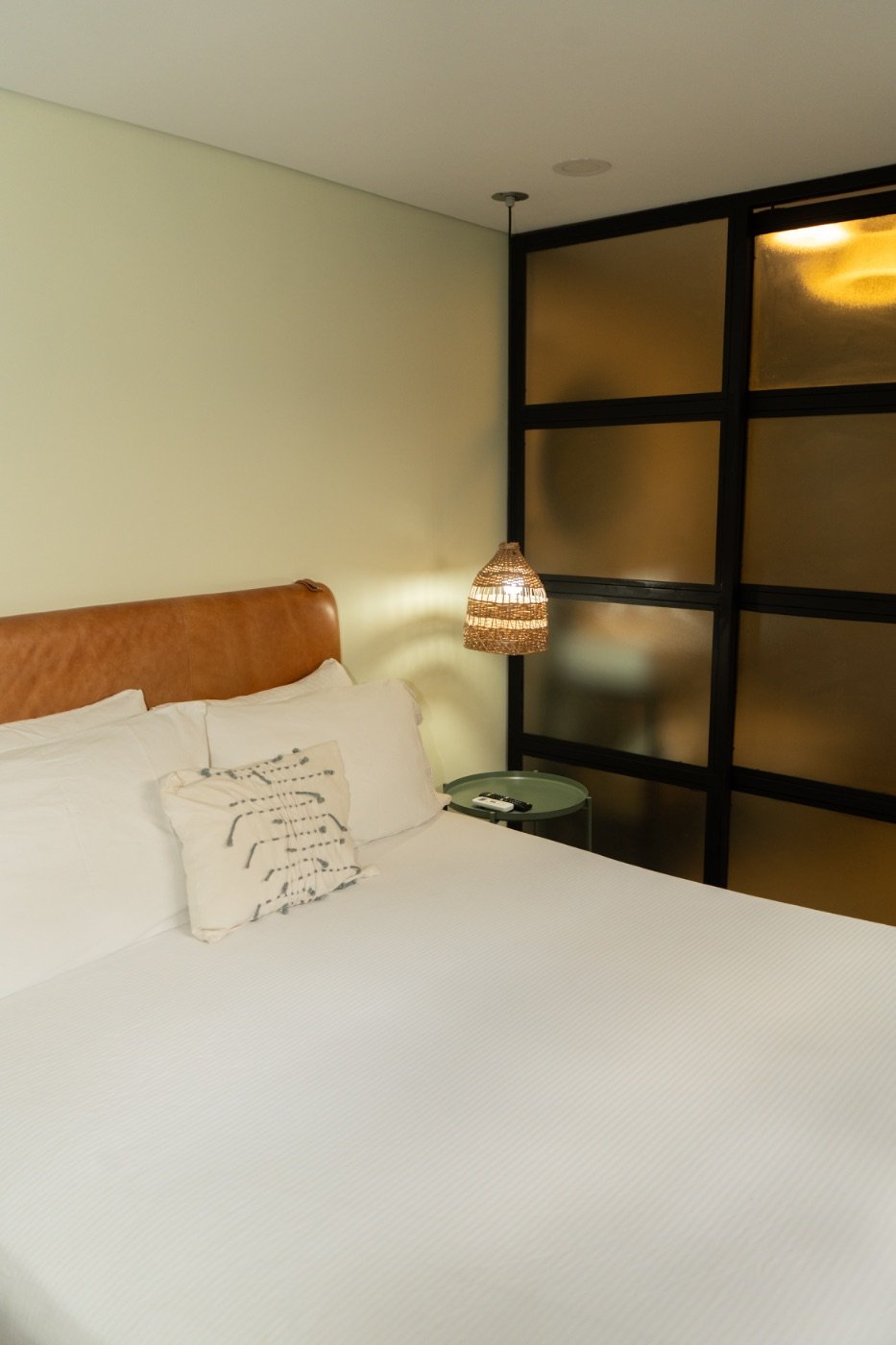 XS Room bedside with rattan pendant and frosted glass partition