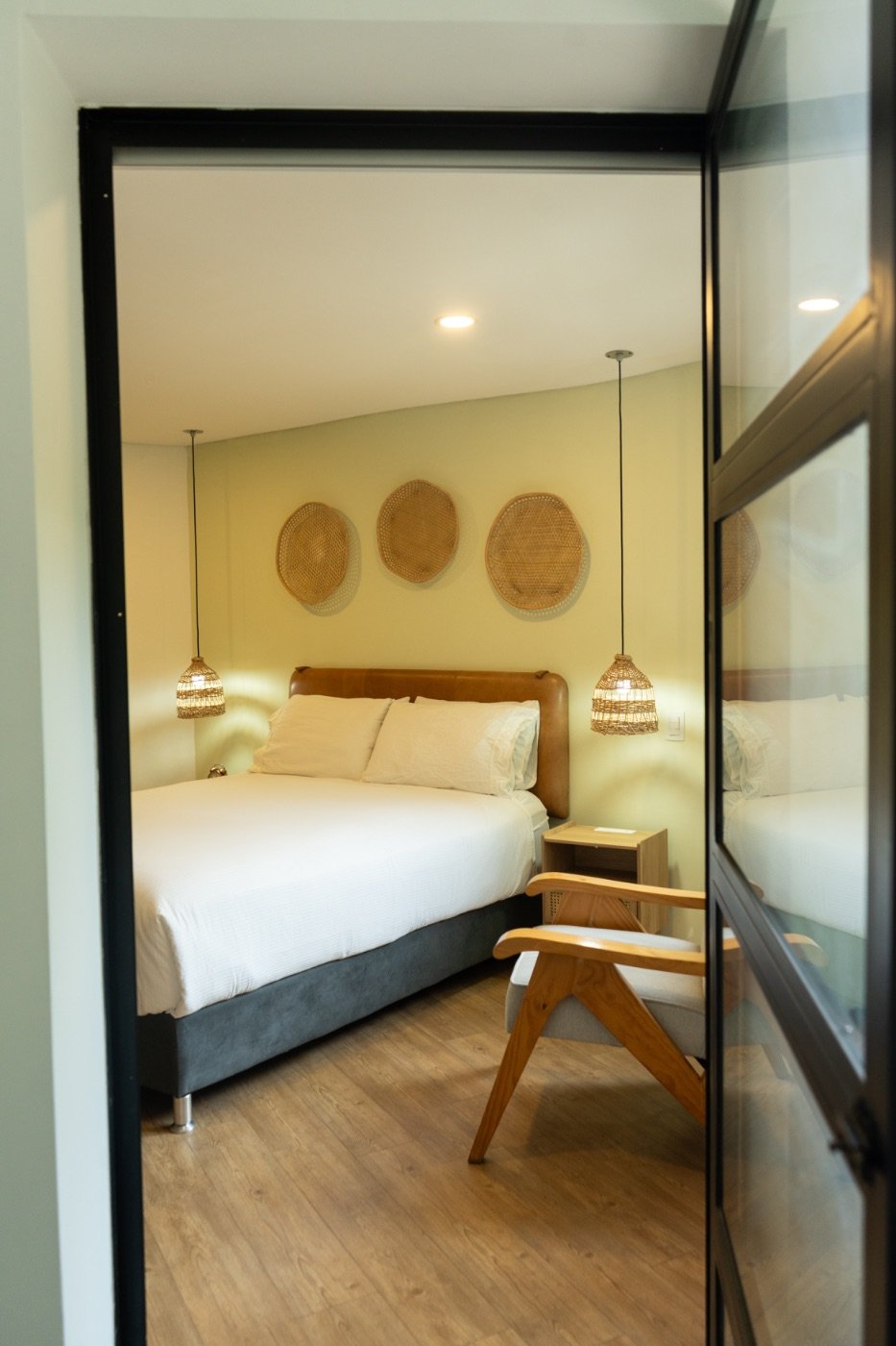 Balcony Room seen through its black-framed glass door