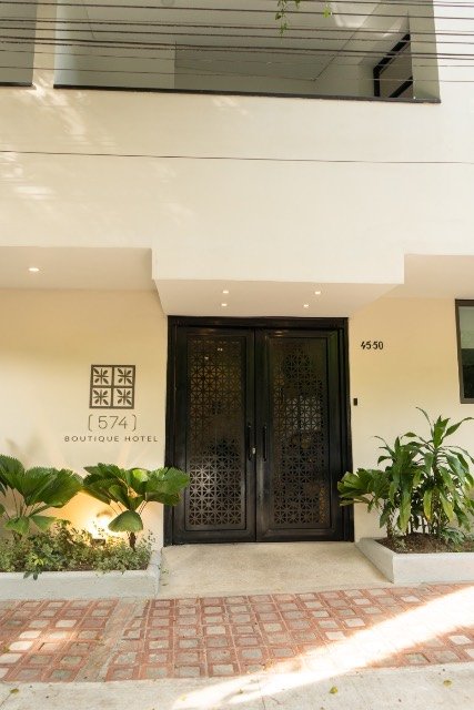 Black lattice entrance doors of 574 Boutique Hotel