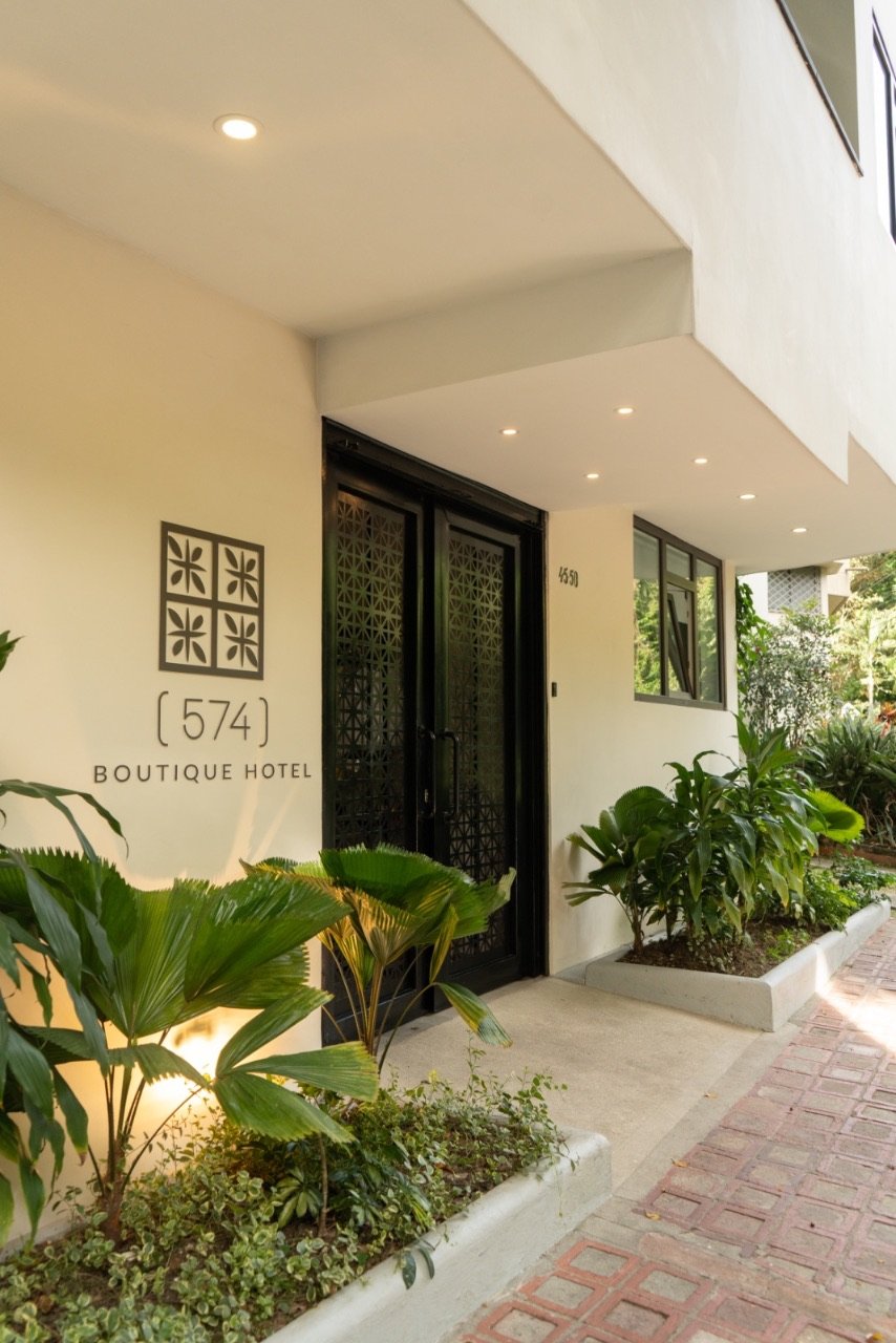 Garden entrance of 574 Boutique Hotel in El Poblado, Medellín at golden hour